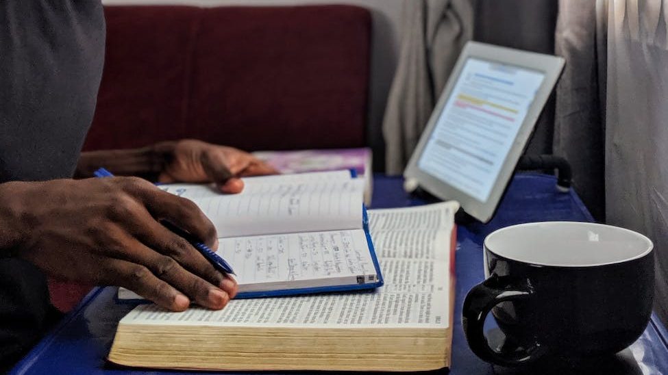 Journaling for mental clarity - Open journal with pen on table.