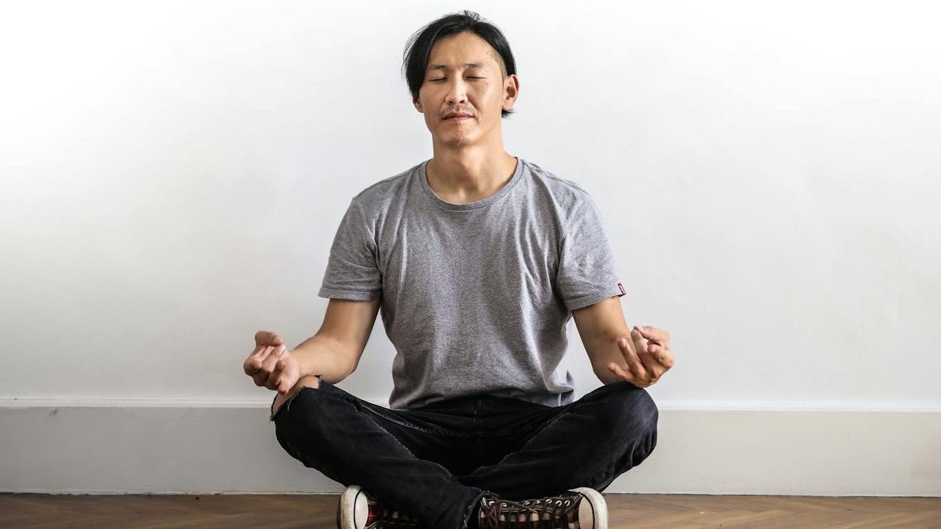 Mindfulness meditation for emotional healing - Person practicing mindfulness meditation in a peaceful setting.