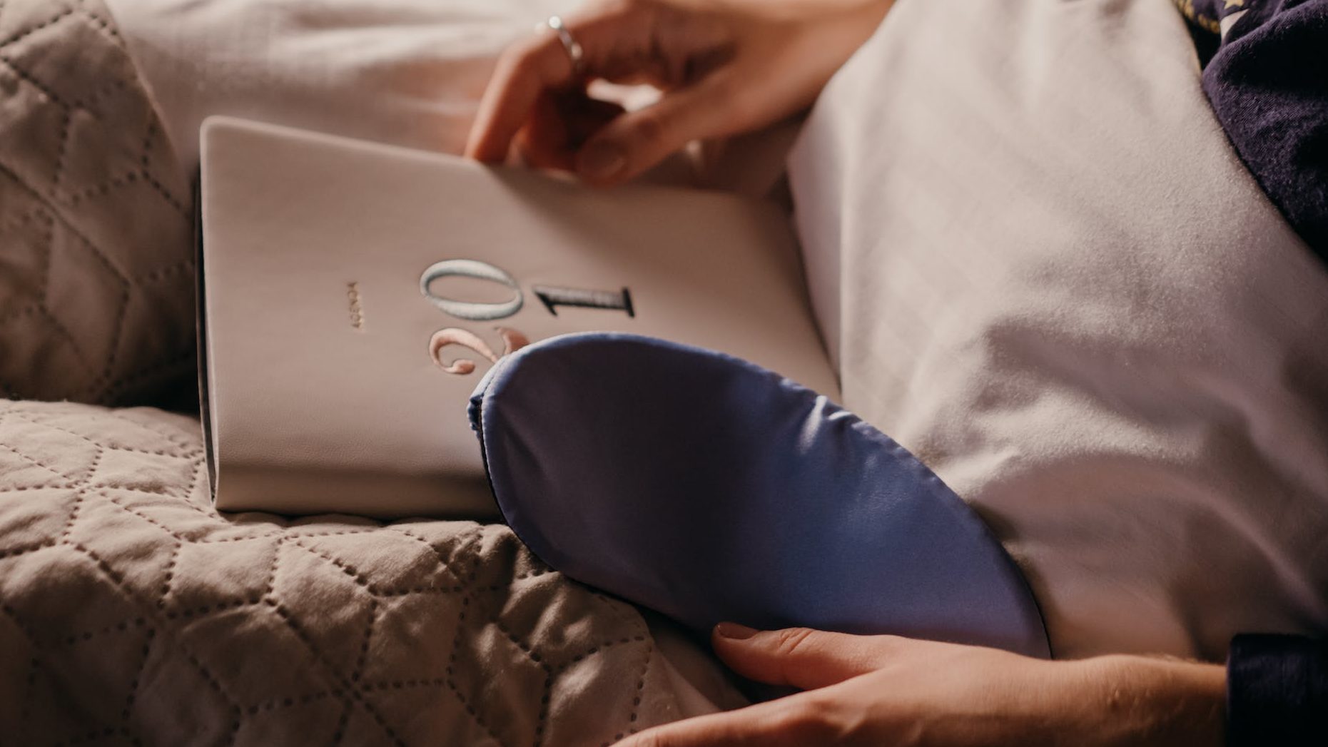 Self-care for managing emotional distress - Collage of self-care items including a cozy blanket, scented candles, and a journal.