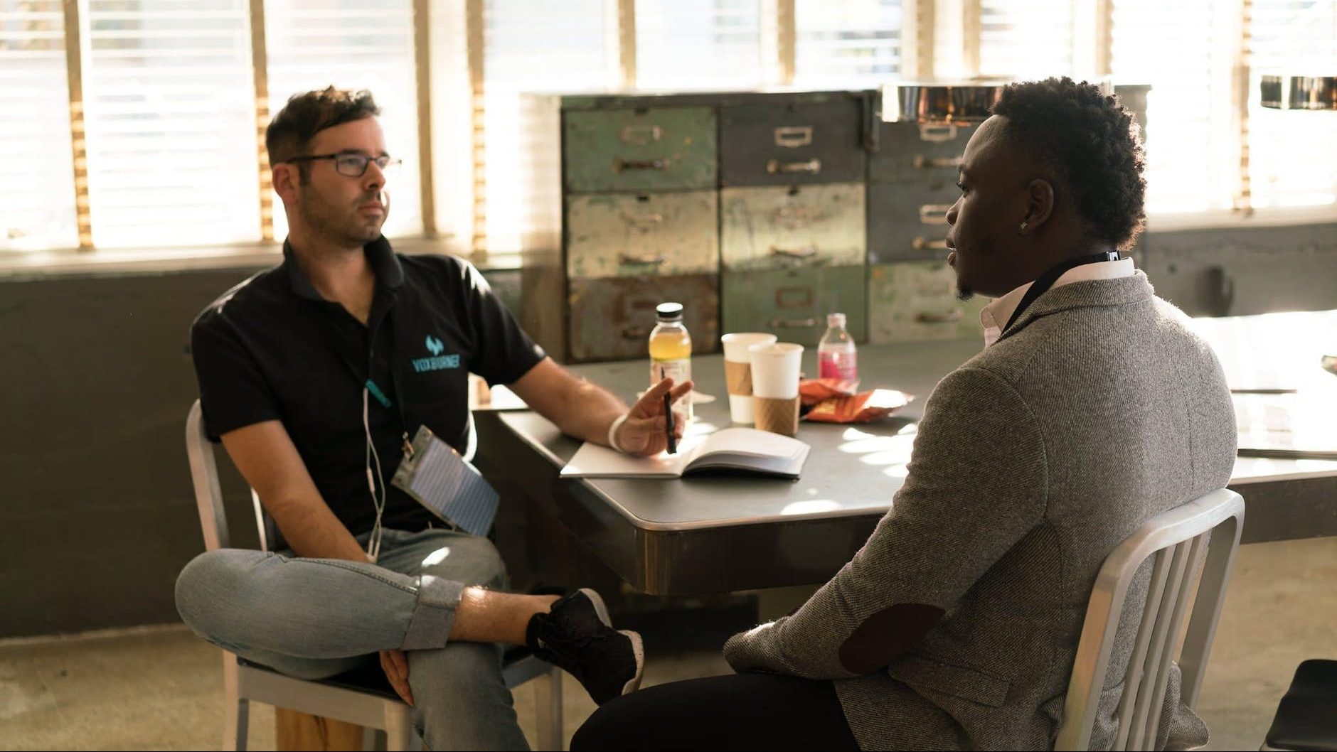 Therapist supporting client in managing emotional distress - Therapist providing support and validation to a client in a counseling session.