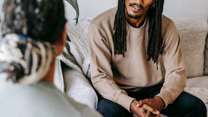 Two people engaged in a supportive conversation.