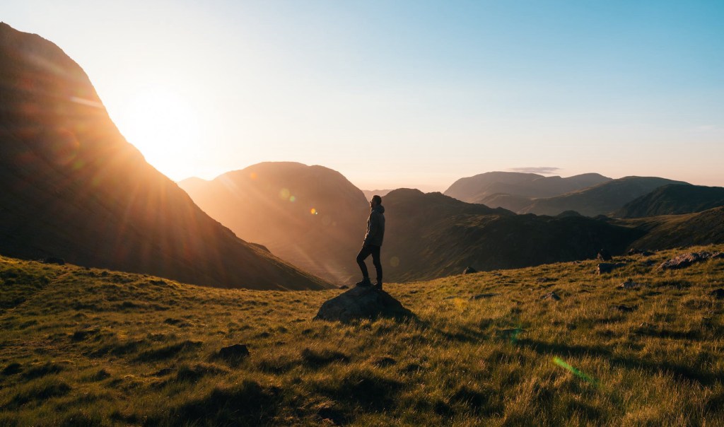 A person hikes up a mountain trail, symbolizing the journey of personal growth and self-discovery. Jennifer Adair LPC, Onesta Therapy Co.