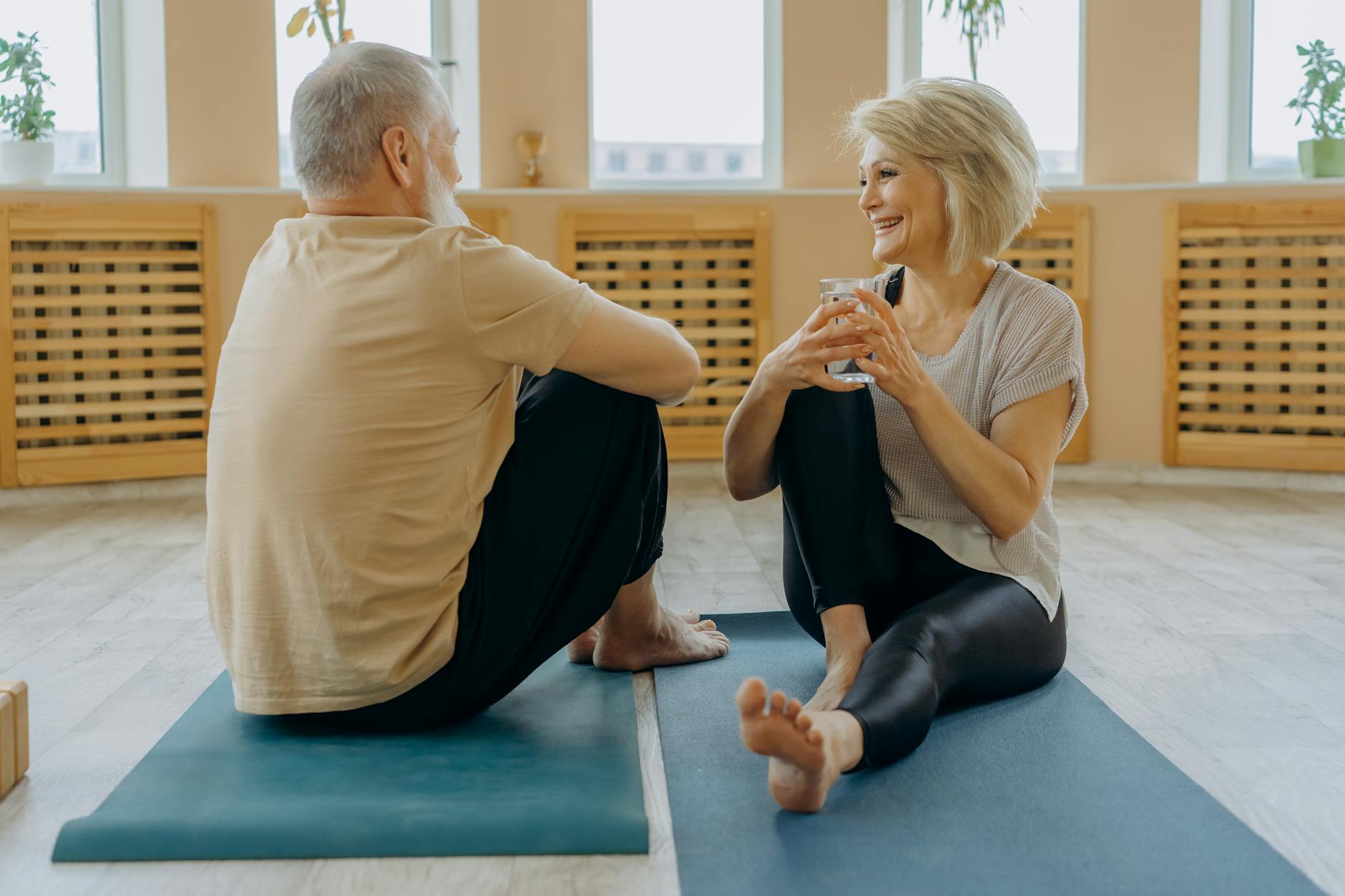 Two people sitting together, engaged in a respectful conversation, demonstrating effective communication skills.