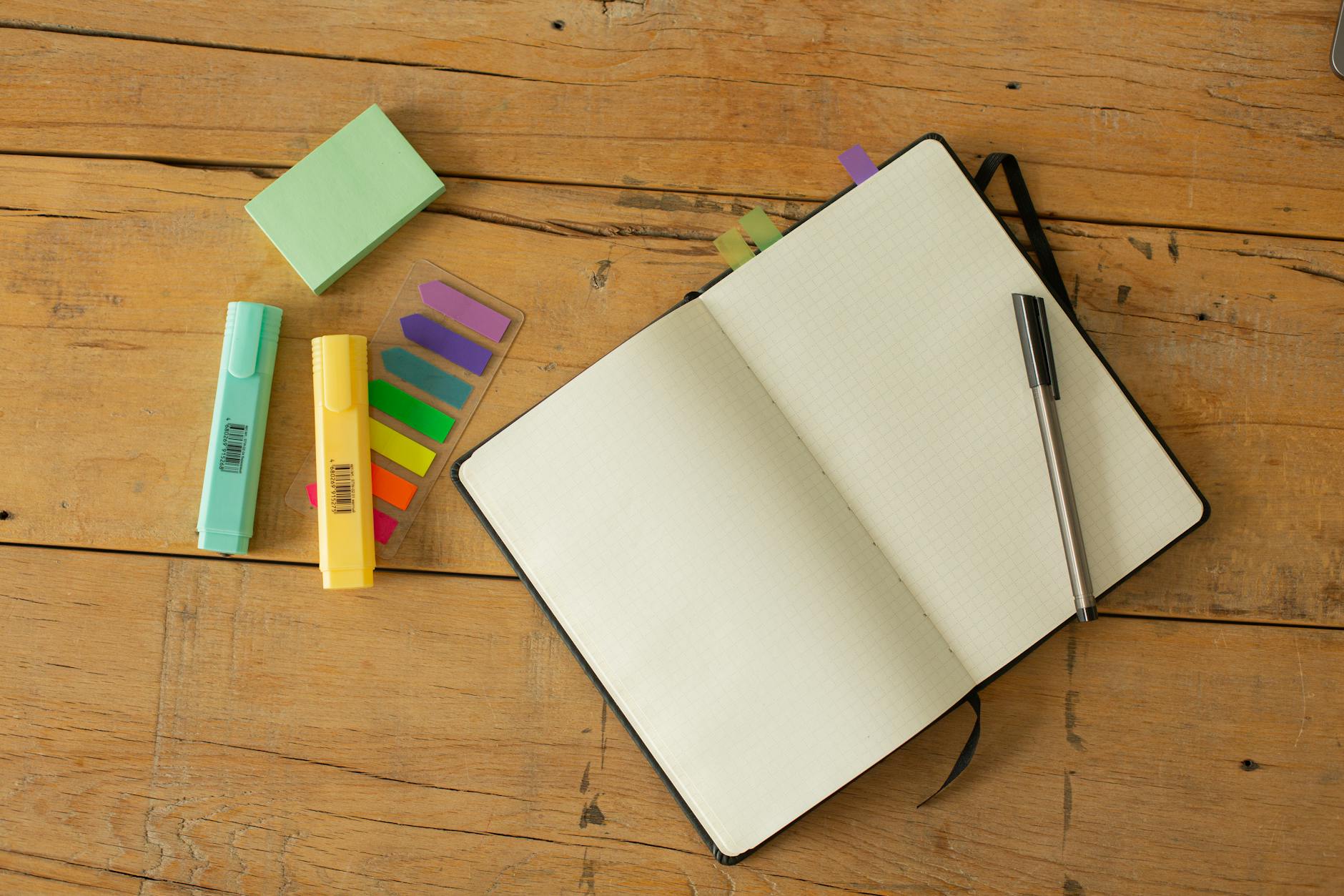 Colorful journal with pen resting on top, symbolizing journaling as a tool for mental clarity and self-reflection.